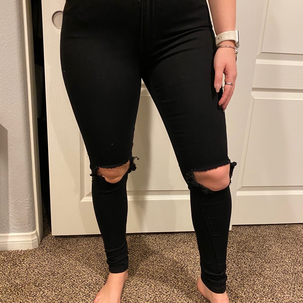 Black jeans with ripped knees